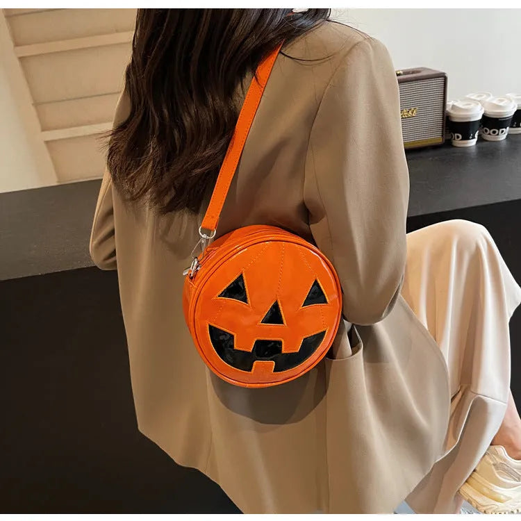 Small round pumpkin-shaped PU shoulder bag in orange for Halloween