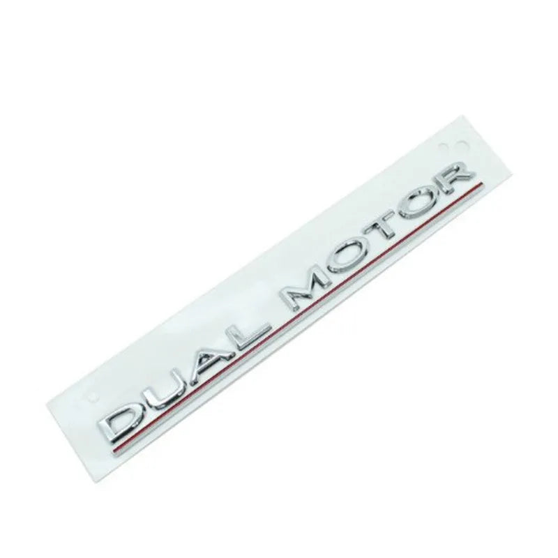 Tesla Model 3 Dual Motor bumper sticker in ABS plastic, shown in matte black with a black stripe, dimensions 19cm by 3cm.