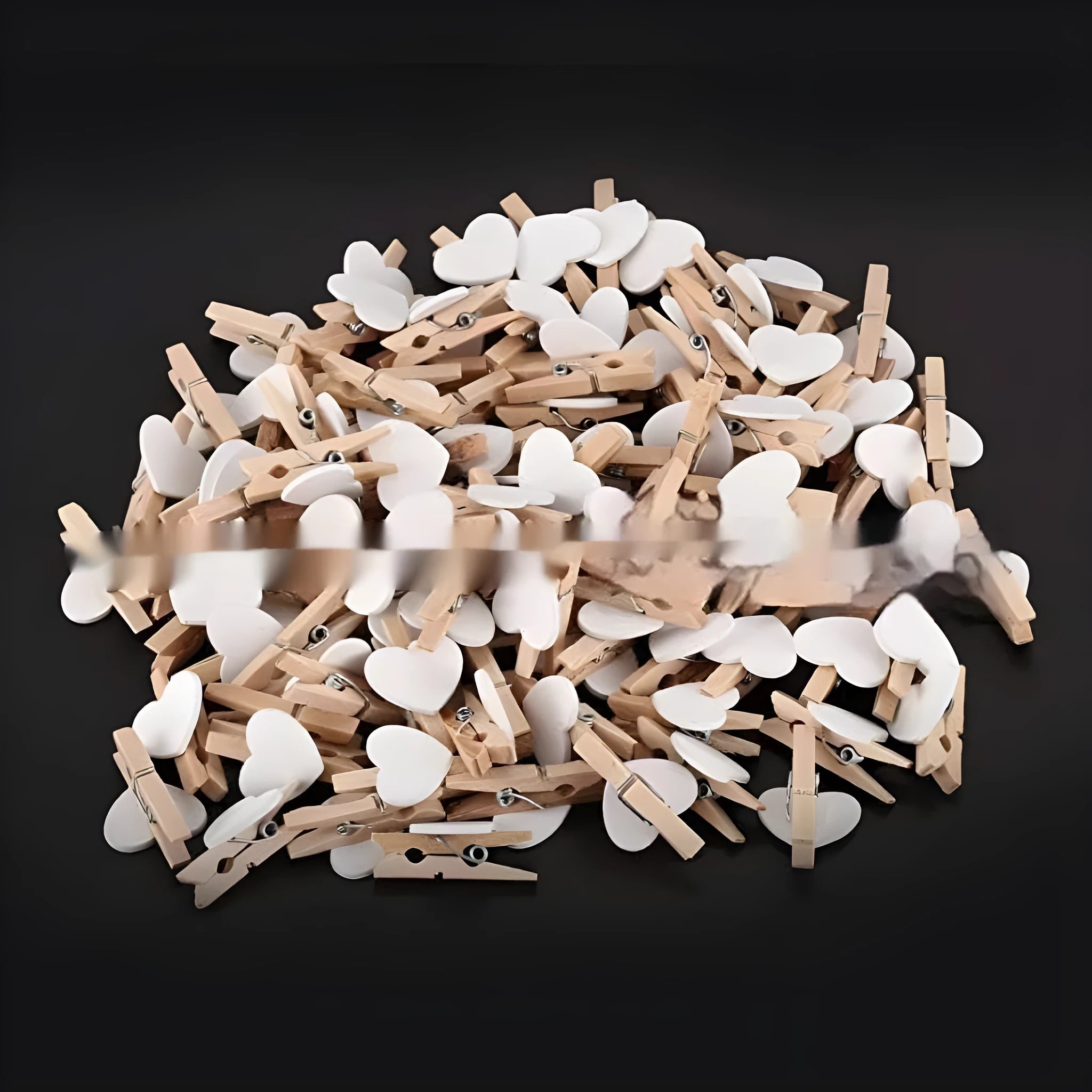 Set of five handmade solid wood heart-shaped clips in red, rose red, and white colours on a plain background.