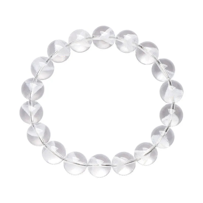Women's adjustable white crystal ghost pyramid bracelet with Ruyi charm on wrist.