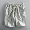 Men's striped cotton casual shorts in a loose straight-leg fit on a mid-waist.