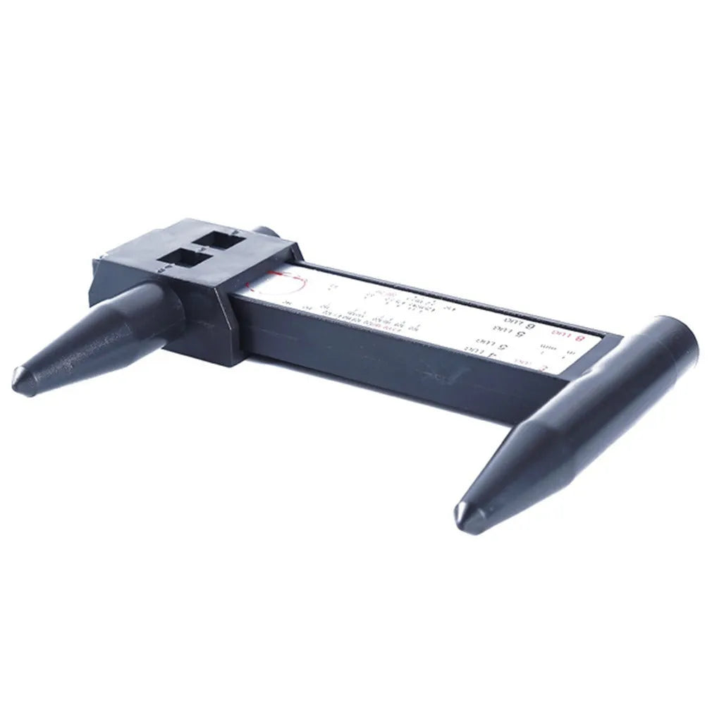 Digital electronic caliper hole distance measuring tool made from black plastic on a white background.