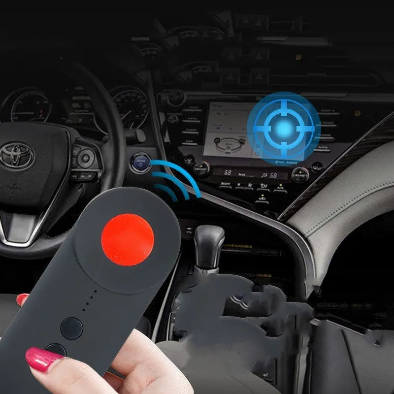 Black portable GPS and hidden camera signal detector showing compact size and Micro USB charging port.
