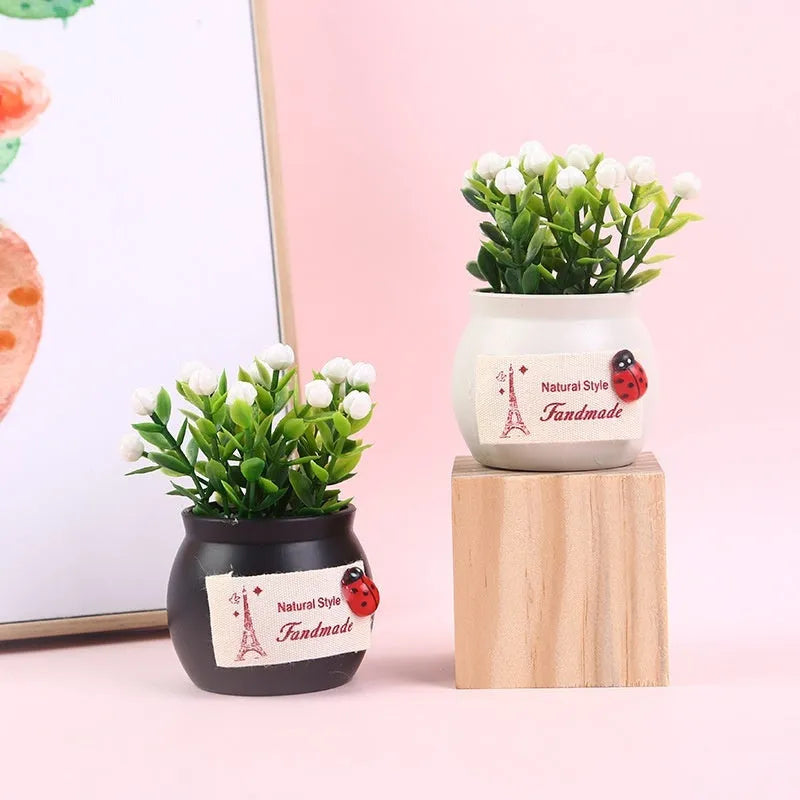 Auspicious fruit potted plant car ornament in a plastic vase, available in black or white, for car interior decoration and odour removal