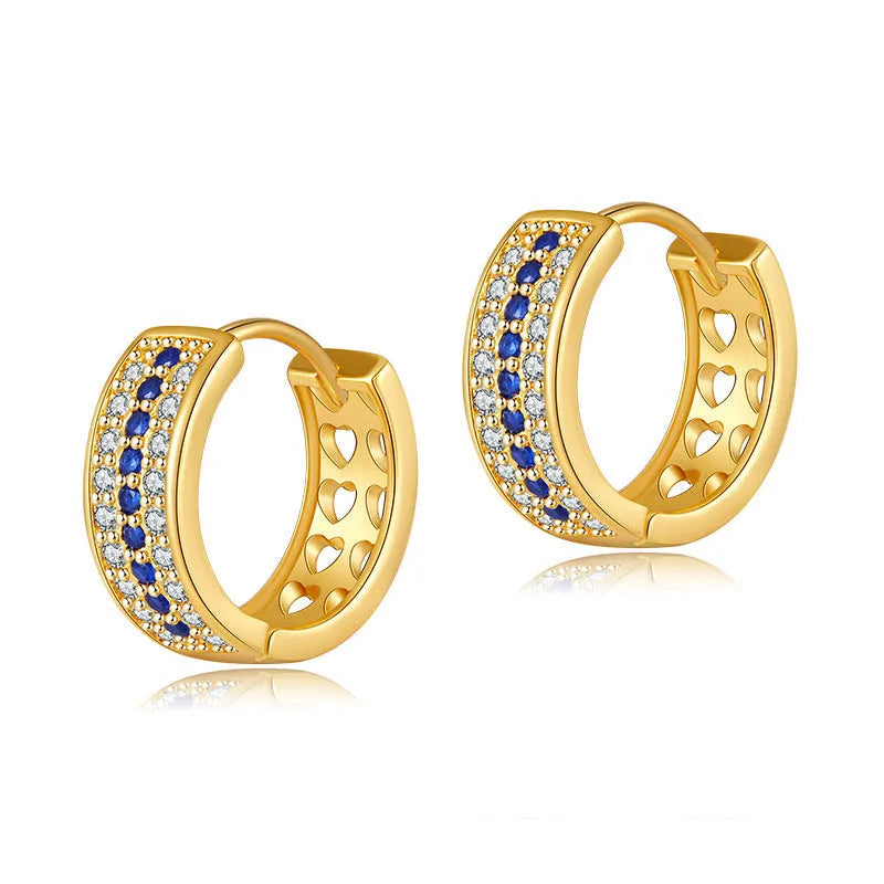 A pair of round, geometric copper earrings with an 18K electroplated gold-colour finish.