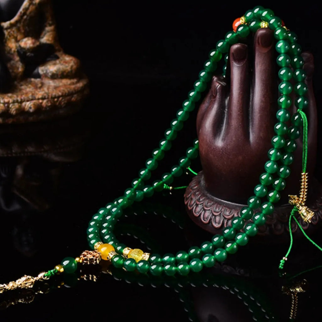 Handmade multi-strand green agate bracelet from Brazil on a wrist, showing stone sizes 6mm, 8mm, and 10mm.
