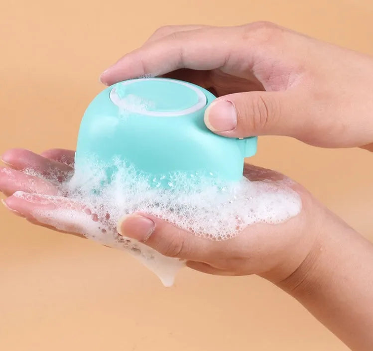 Blue silicone dog bath and massage brush for pet grooming