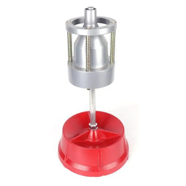 Portable hub balancer with aluminium head and enamel-finished base for balancing car and truck tyres.