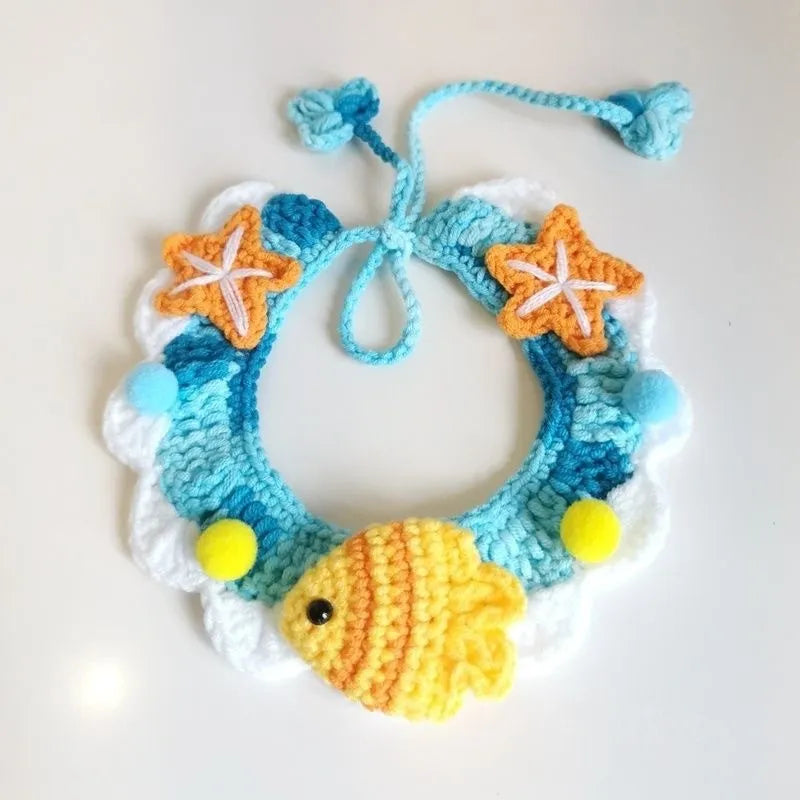 Hand-woven wool cat collar with cartoon Underwater World pattern in blue, size example on a light background