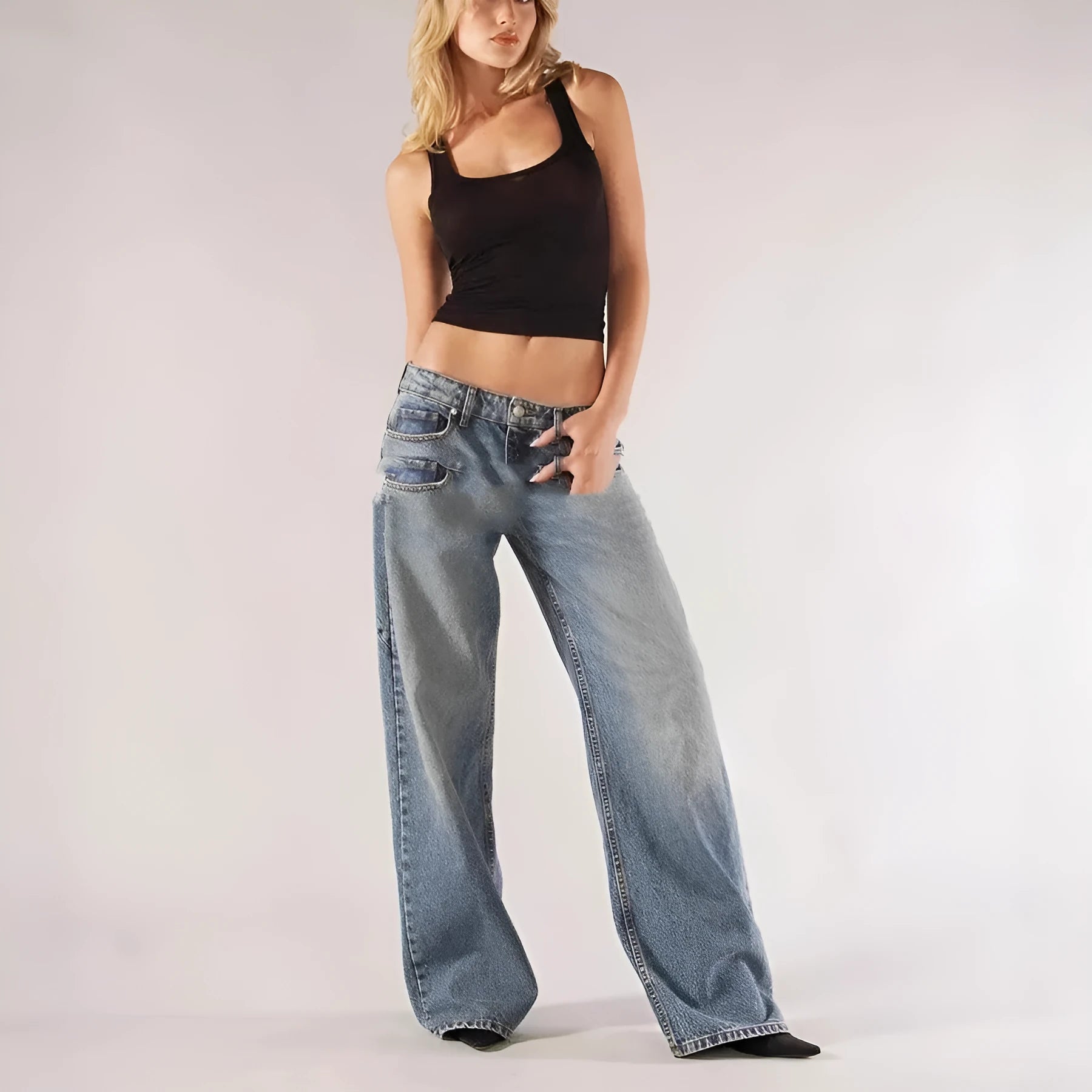 Blue loose fit wide leg mop trousers with low waist and straight leg cut on a person.