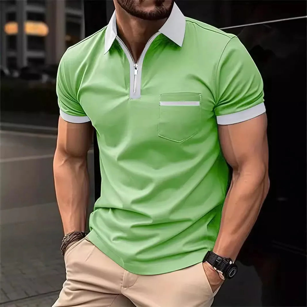 Man wearing a loose-fit casual short-sleeved shirt with a chest pocket and zipper decoration details.