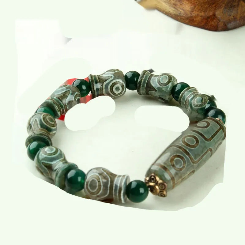 Distressed agate Tibet beads bracelet with three eye dzi design and polished stone beads