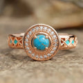 Women's geometric turquoise ring with zircon inlay on rose gold copper band, showing ethnic style design