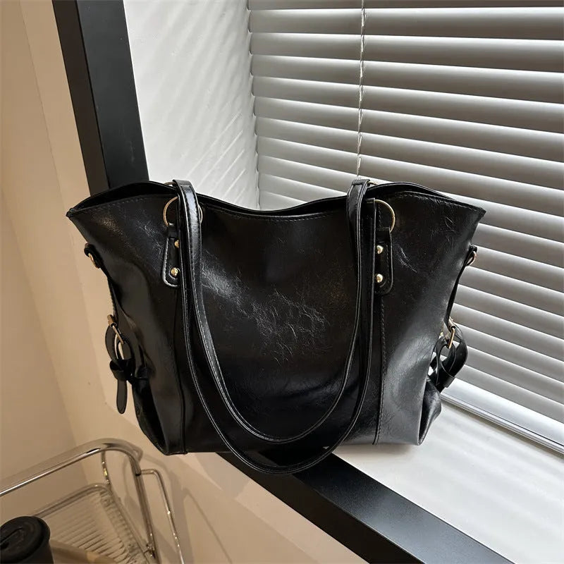 Soft PU retro commuter tote bag with synthetic leather lining, double shoulder straps, and zip hidden pocket in black or brown.