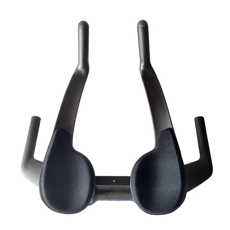 Matte black carbon fibre TT handlebar for time trial and triathlon bikes on a road bicycle.