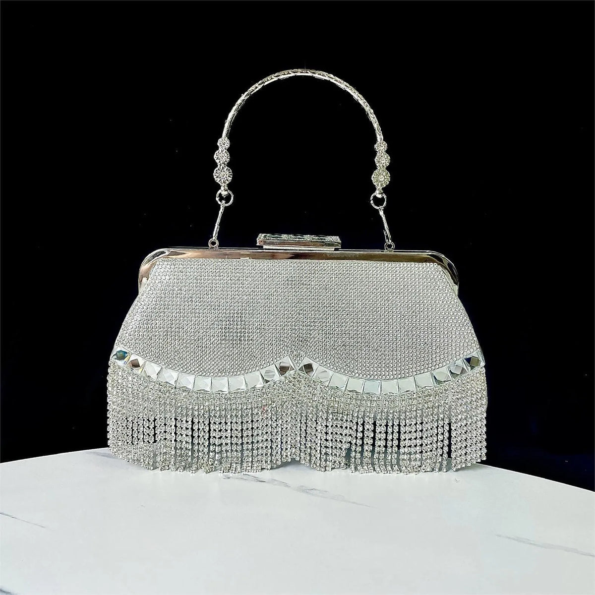 Tassel banquet bag in silver, gold or black polyester with shell shape and chain detail