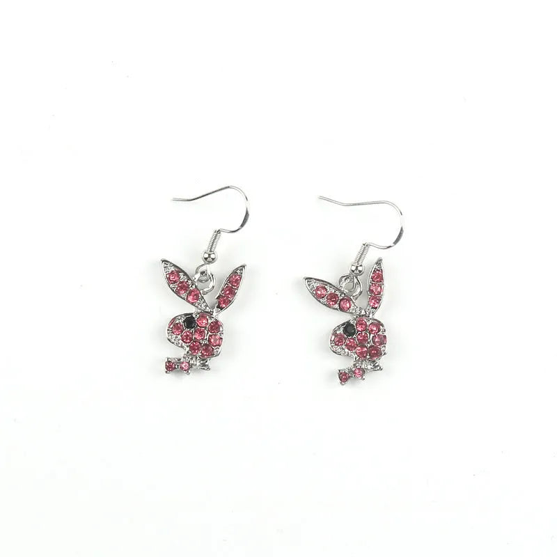 Close-up of cute rabbit stud earrings with full diamond face, in silver, pink, or gold alloy.