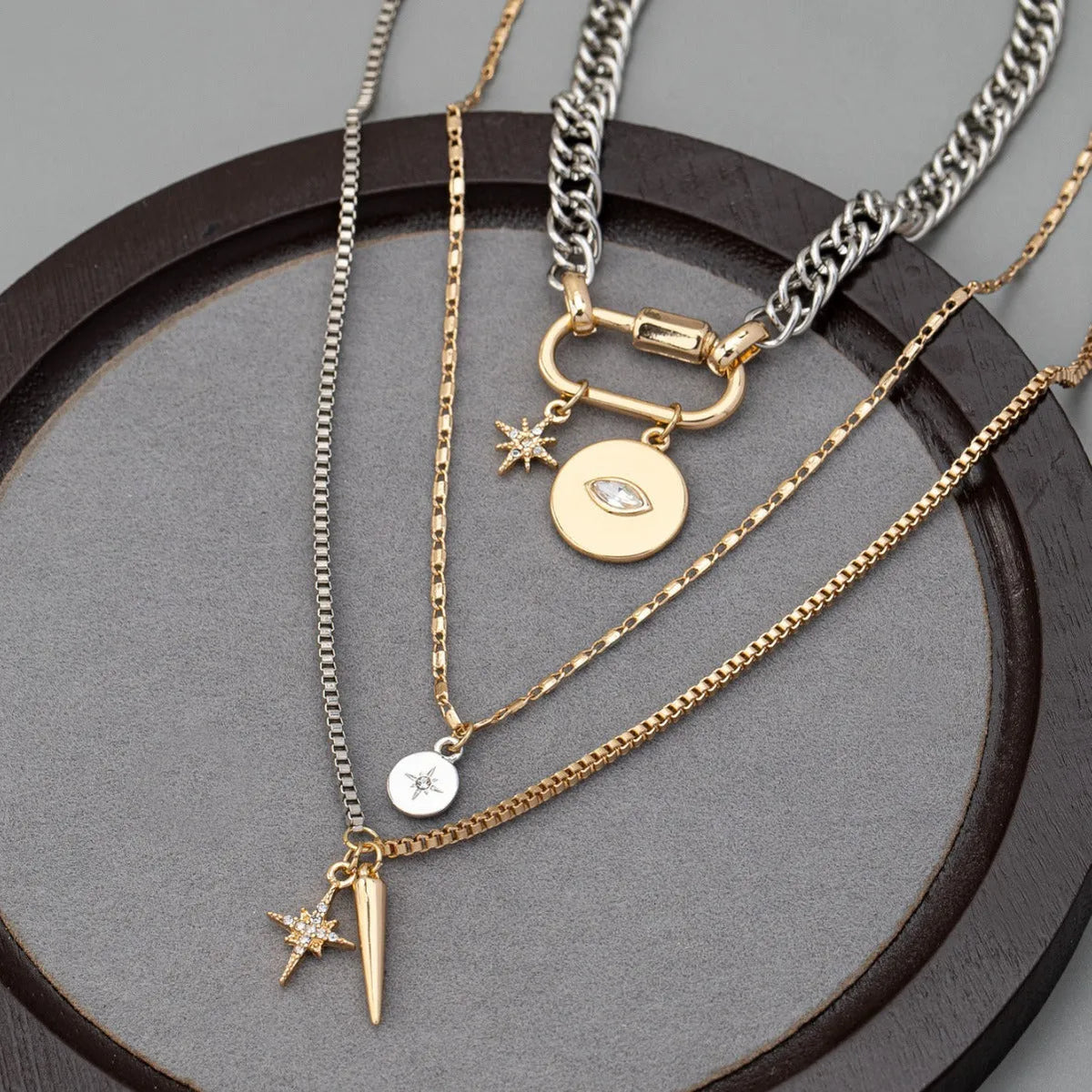 Eye pendant multi-layer twin necklace for women with alloy electroplated clavicle chain and geometric ellipse shapes.