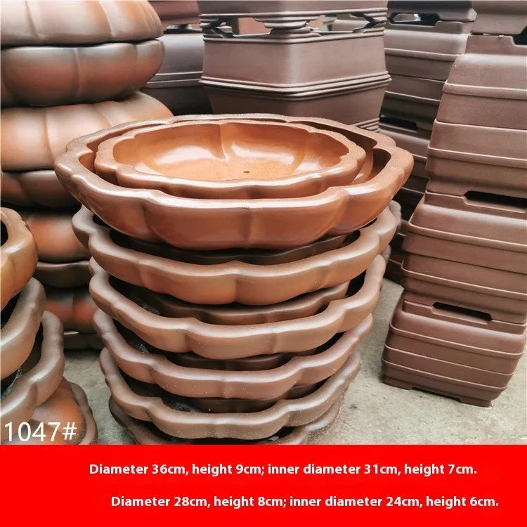 Round purple sand flower pot in red colour 35-40cm on desktop