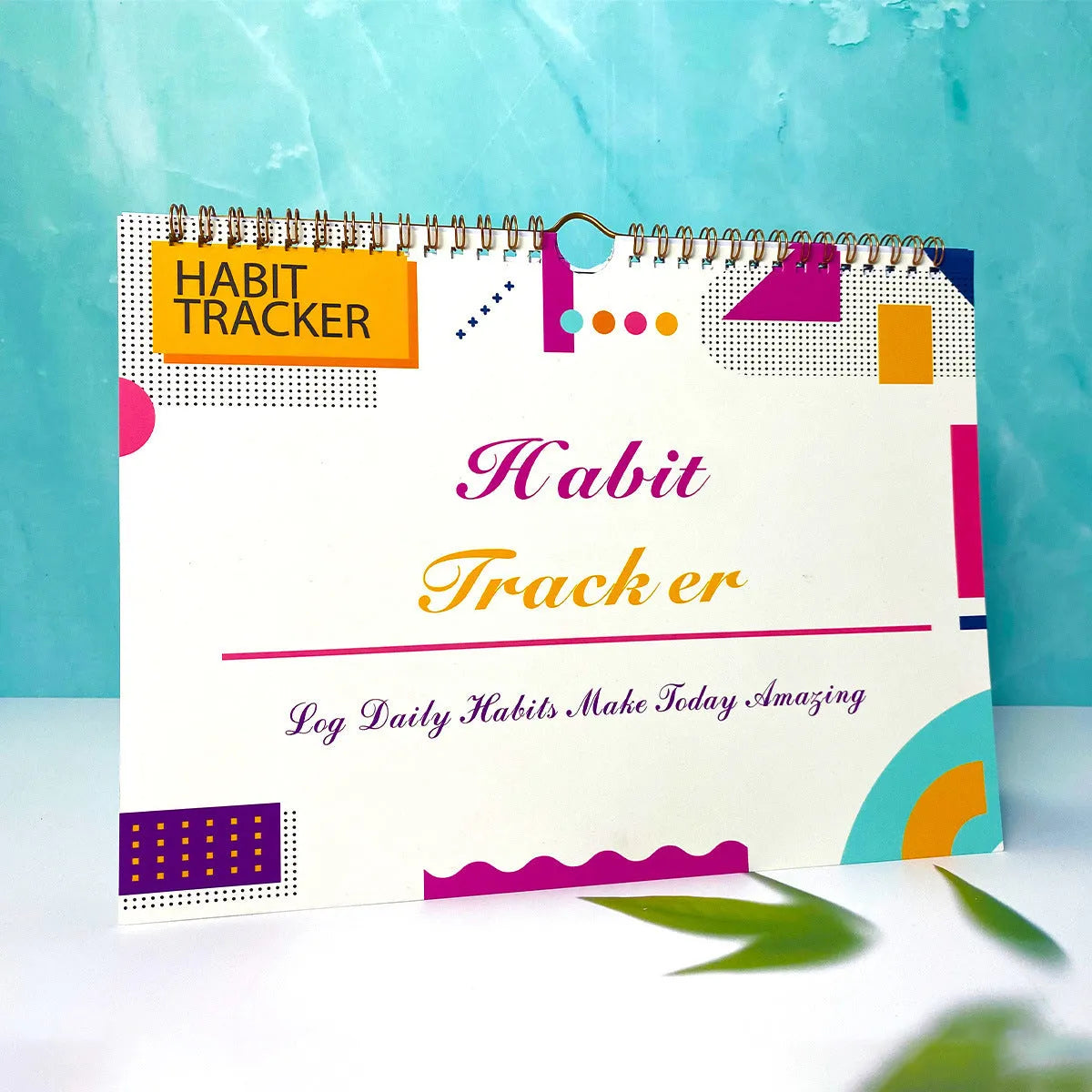 Habit tracking book with 12 pages measuring 21cm by 28cm in four colour options