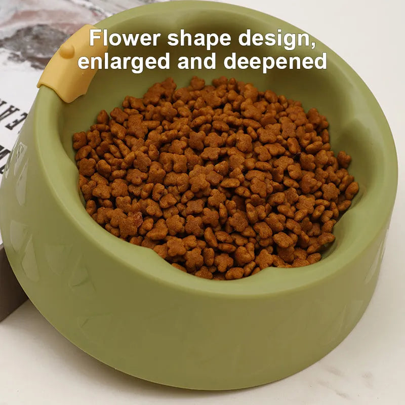 Green plastic double pet bowl for food and water with a flower-shaped, anti-tipping design.