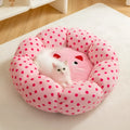 Pink dot pattern fabric cat nest bed in circular design showing two size options for pets up to 20 pounds