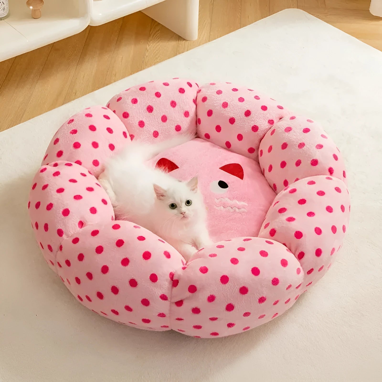 Pink dot pattern fabric cat nest bed in circular design showing two size options for pets up to 20 pounds