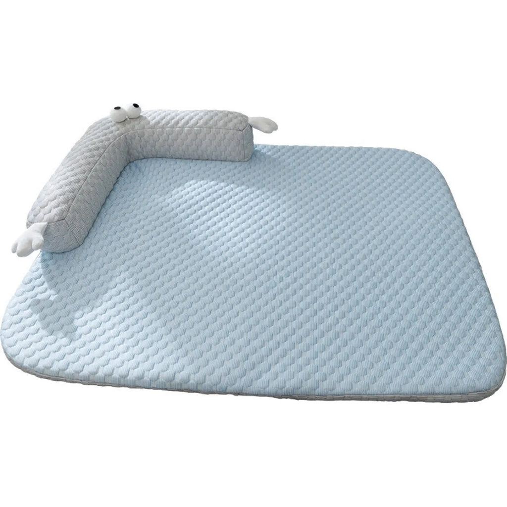 Blue big-eyed monster design pet bed cushion for dogs on a wooden floor.