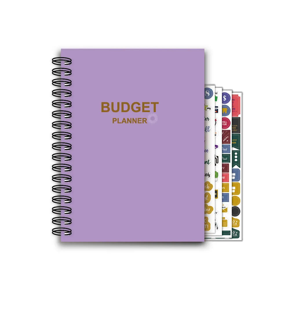 Purple coil-bound financial planning notebook with pen, stickers and paper clips for monthly budgeting