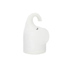 DOMI Elephant shaped silicone night light with warm white LED glow on a bedside table.