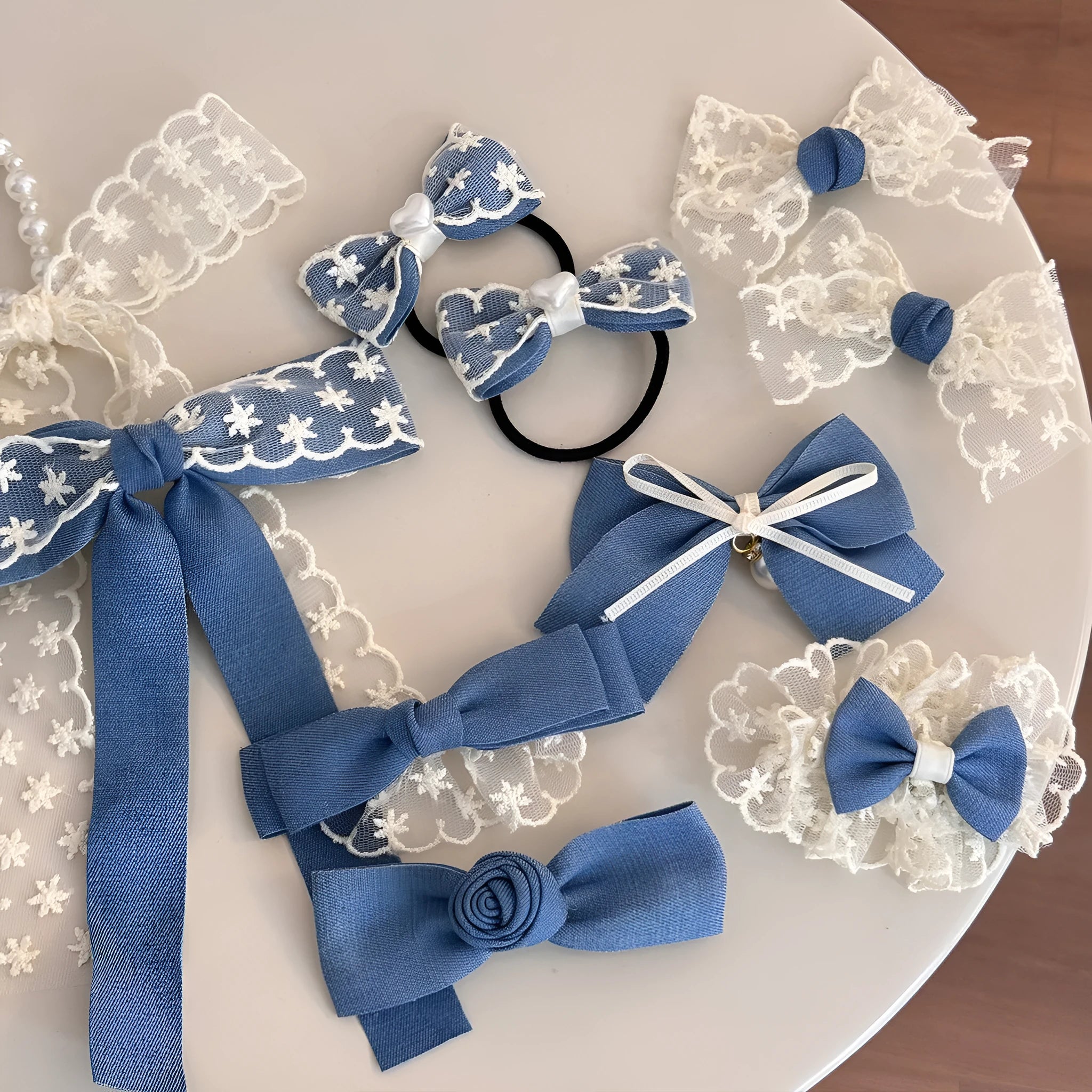 Fabric hair clips with lace, bow, and pearl butterfly designs for women