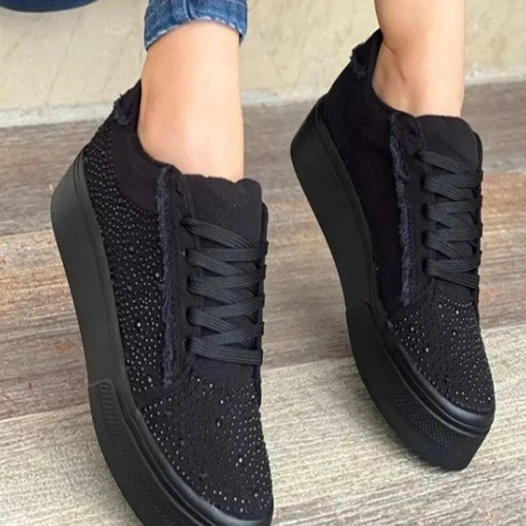 Plus size women's black lace-up casual pumps with rhinestones on a thick rubber sole.