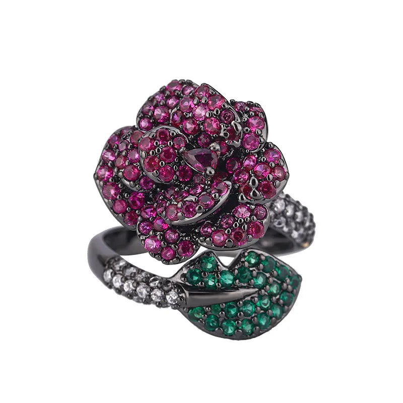Gold-plated copper ring with geometric flower design and simulation red corundum in black gold finish