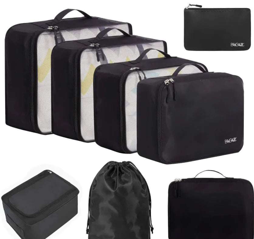 Set of eight cubic packing cubes for travel organisation in various colours including beige, black, and pink leopard print.
