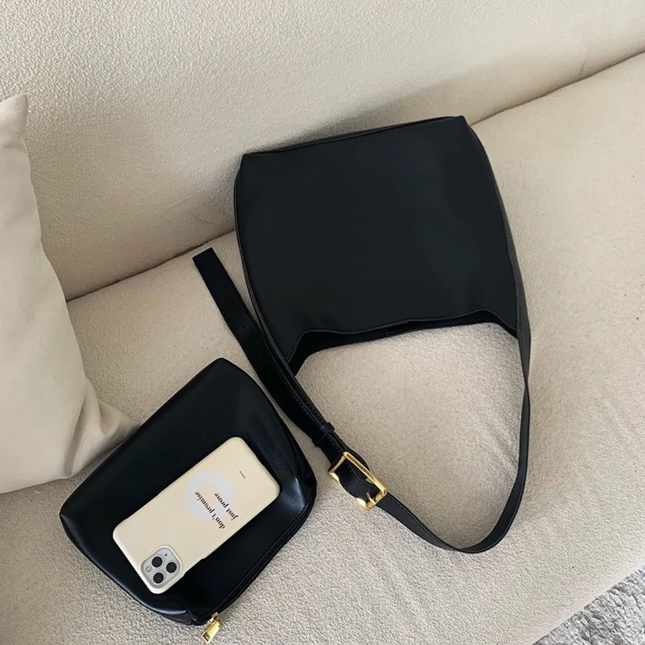 Ladies' shoulder bag with swing thread details in soft PU material showing black and brown colour options