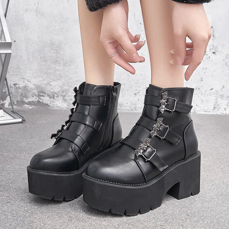 Black women's punk style Martin boots with a side zipper and thick heel.