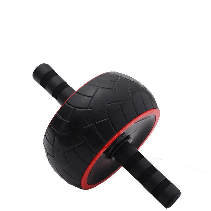 Black and red single-wheel abdominal muscle roller on a home exercise mat with dimensions 9x18x32.5 cm