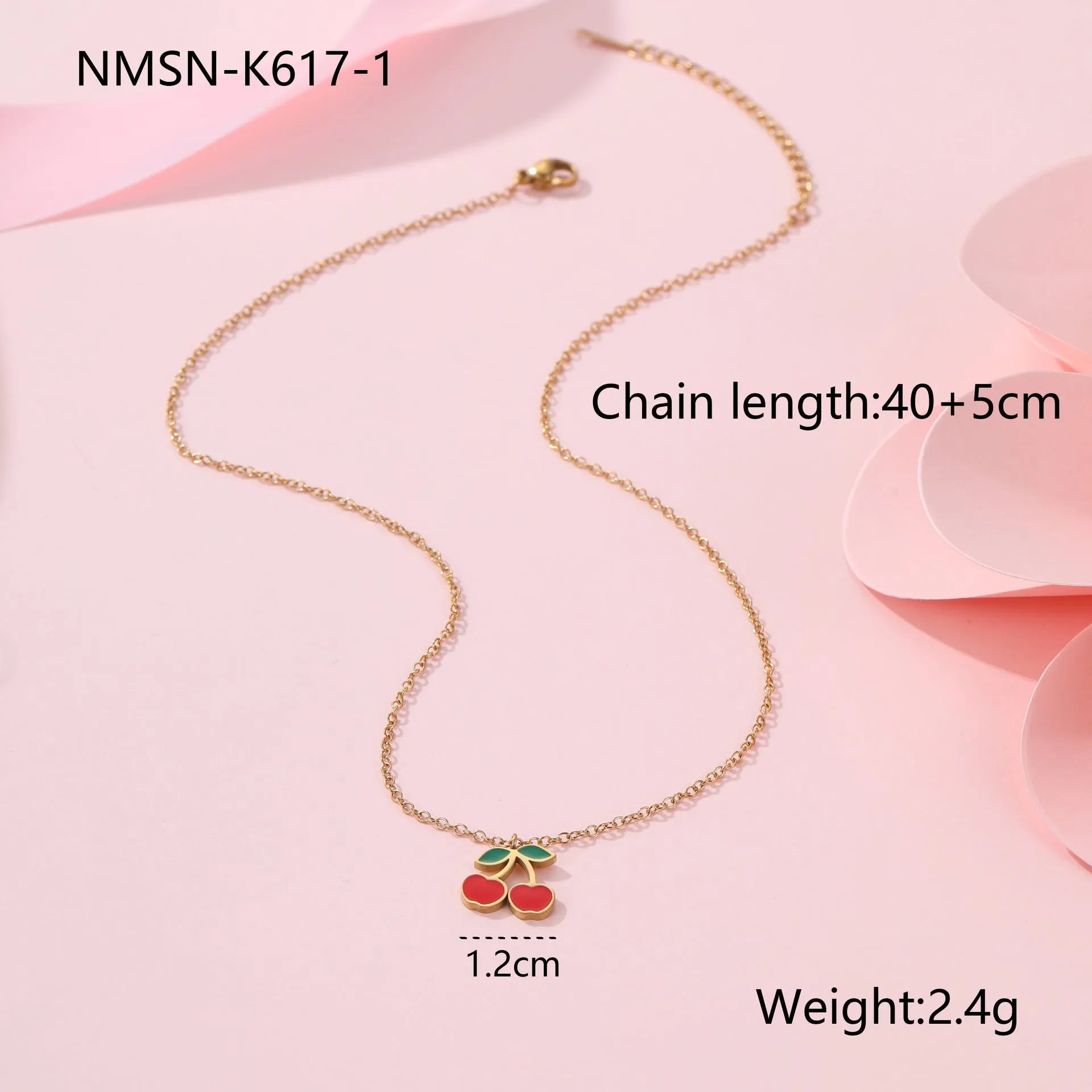 Complete cherry jewellery set showing stainless steel necklace, bracelet, earrings, and ring pieces with electroplated colour finishes