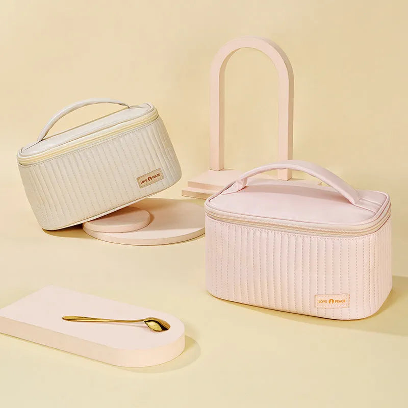 Open-top cake-shaped makeup bag in PU leather showing six colour options
