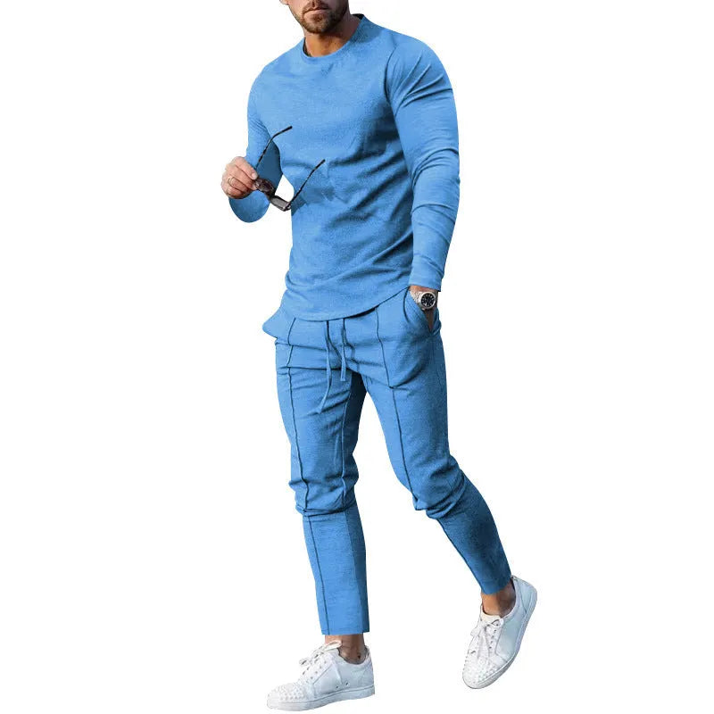 Men's light grey two-piece suit set with long sleeve round neck t-shirt and matching trousers.