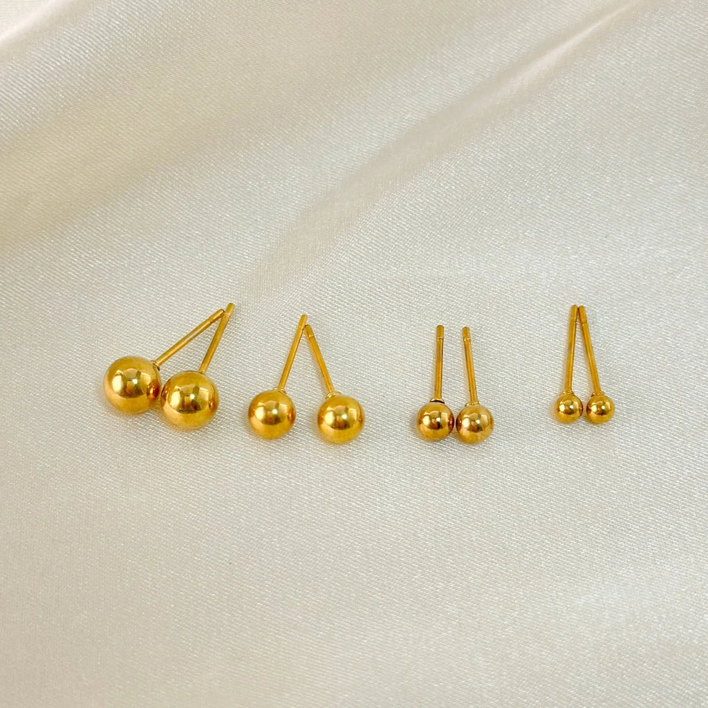 Stainless steel ball stud earrings with gold or silver electroplating in minimalist geometric design.