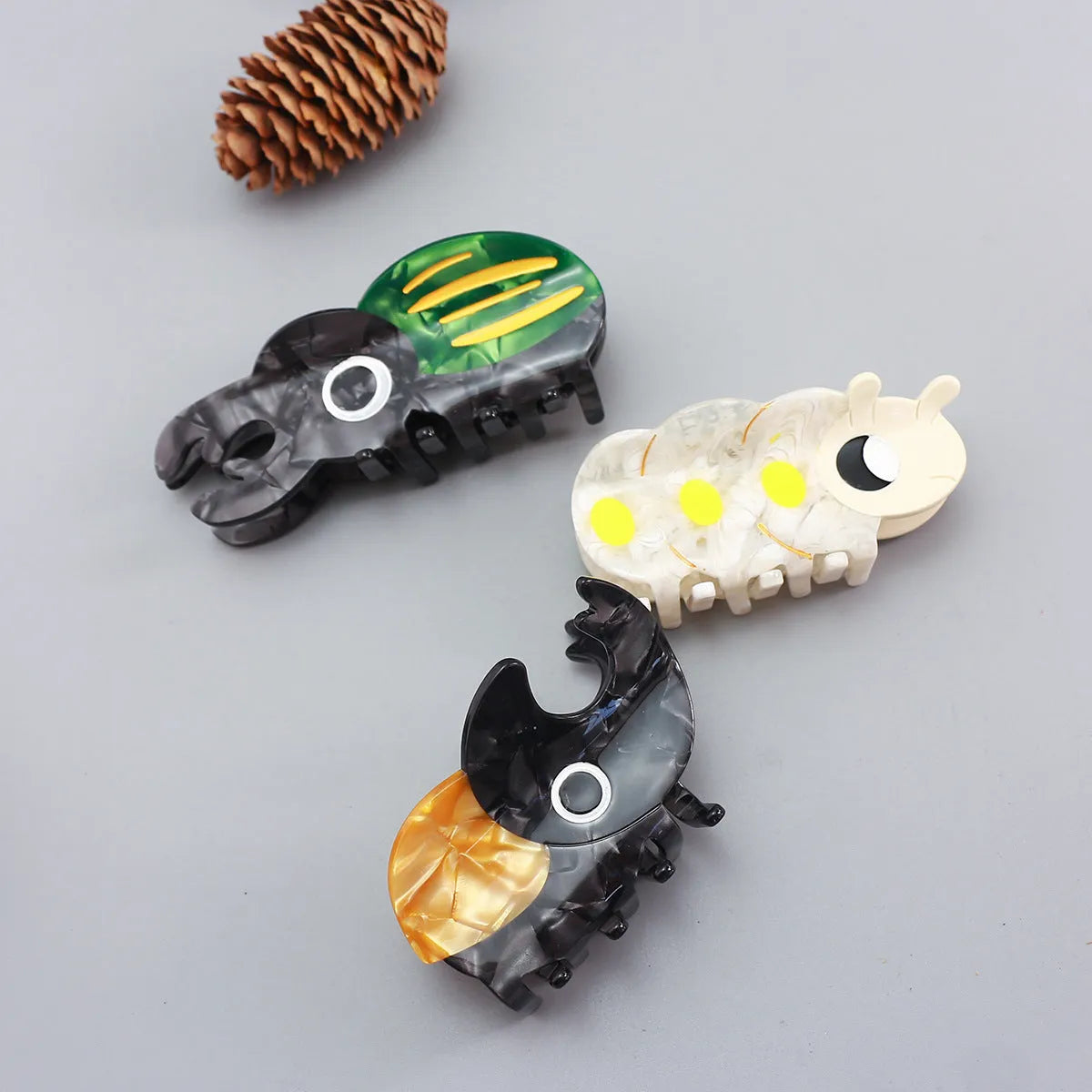 Handmade cellulose acetate beetle hair clip with cartoon insect design in green, orange, or white