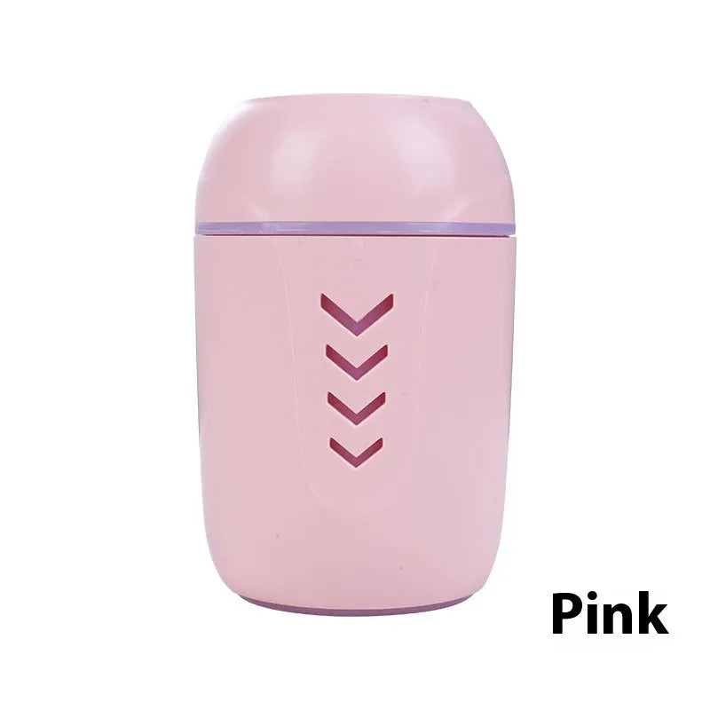 Round white portable USB air purifier for car and desktop use on a wooden surface.