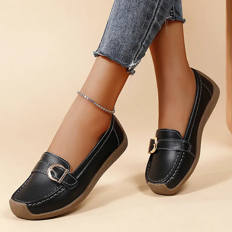 Women's beige casual loafers with round toe and flat beef tendon sole on a white background.