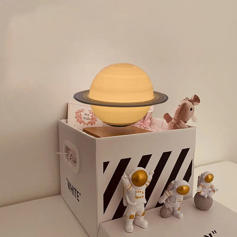 Moon Earth Maglev atmosphere night light with floating planets and astronaut figures on a shelf.