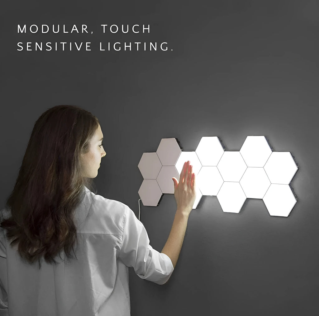 Helios modular honeycomb wall lamp panels in assembled geometric pattern with touch activation