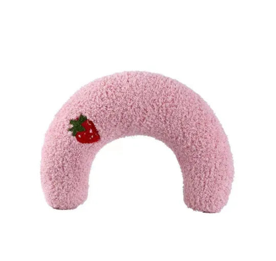 White U-shaped plush pet pillow for a cat, showing its donut shape and quilted texture.