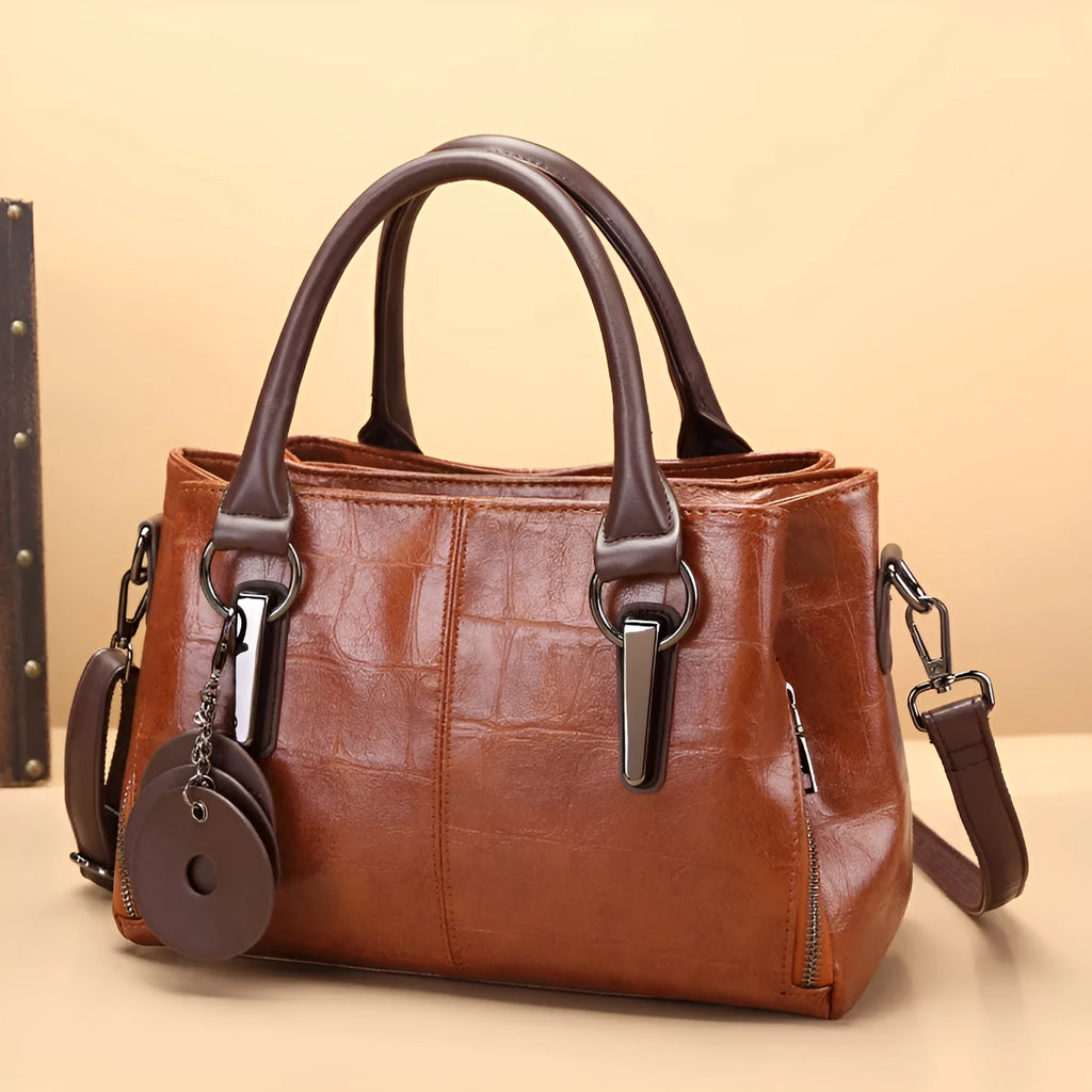PU leather shoulder bag in vintage brown colour with internal organiser compartments and single strap