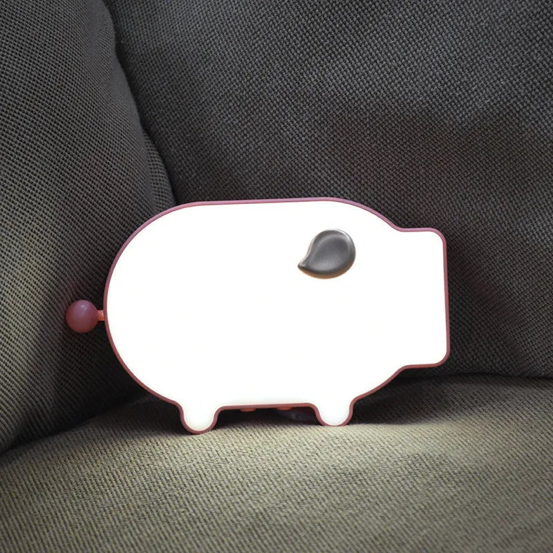 Blue LED digital alarm clock showing time and temperature with USB charging port