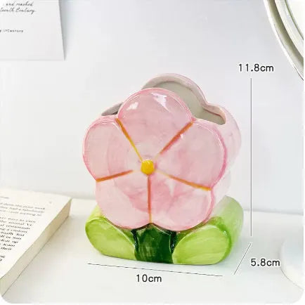 Ceramic flower pen holder storage box in floral pattern colours on desktop